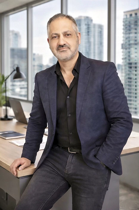 Frank Manti, CPA accountant & CFO, seated at desk,